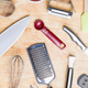 View from above kitchen utensils on wooden surface